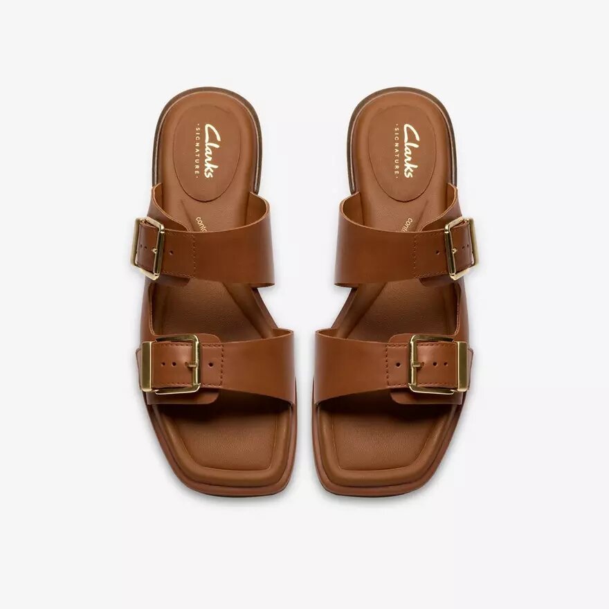 Ariany Bay – platta sandaler i brunt läder för damer Ariany Bay – platta sandaler i brunt läder för damer