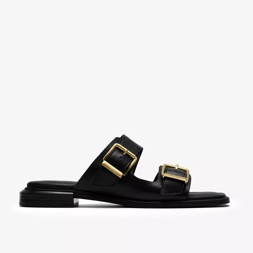 Ariany Bay – platta sandaler i svart läder för damer Ariany Bay – platta sandaler i svart läder för damer