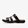 Kitly Pearl – svarta platta sandaler i lackläder för damer Kitly Pearl – svarta platta sandaler i lackläder för damer